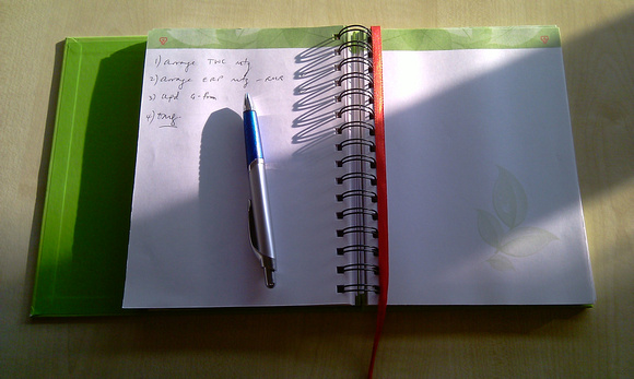 Notepad and pen in morning light