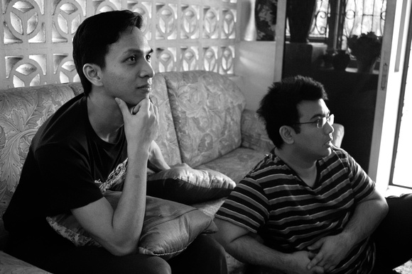 Haniff and Rashid watching TV